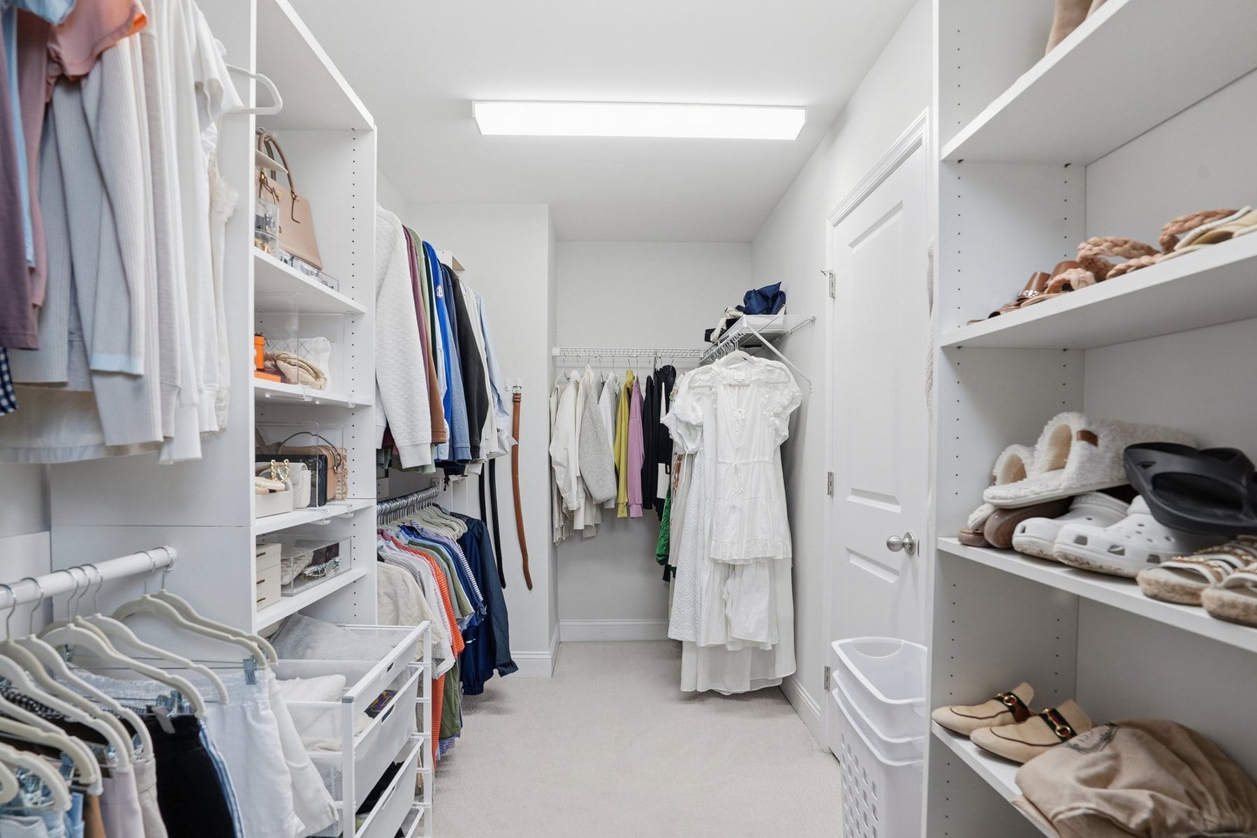 Walk-in closet with built-in shelving and hanging space