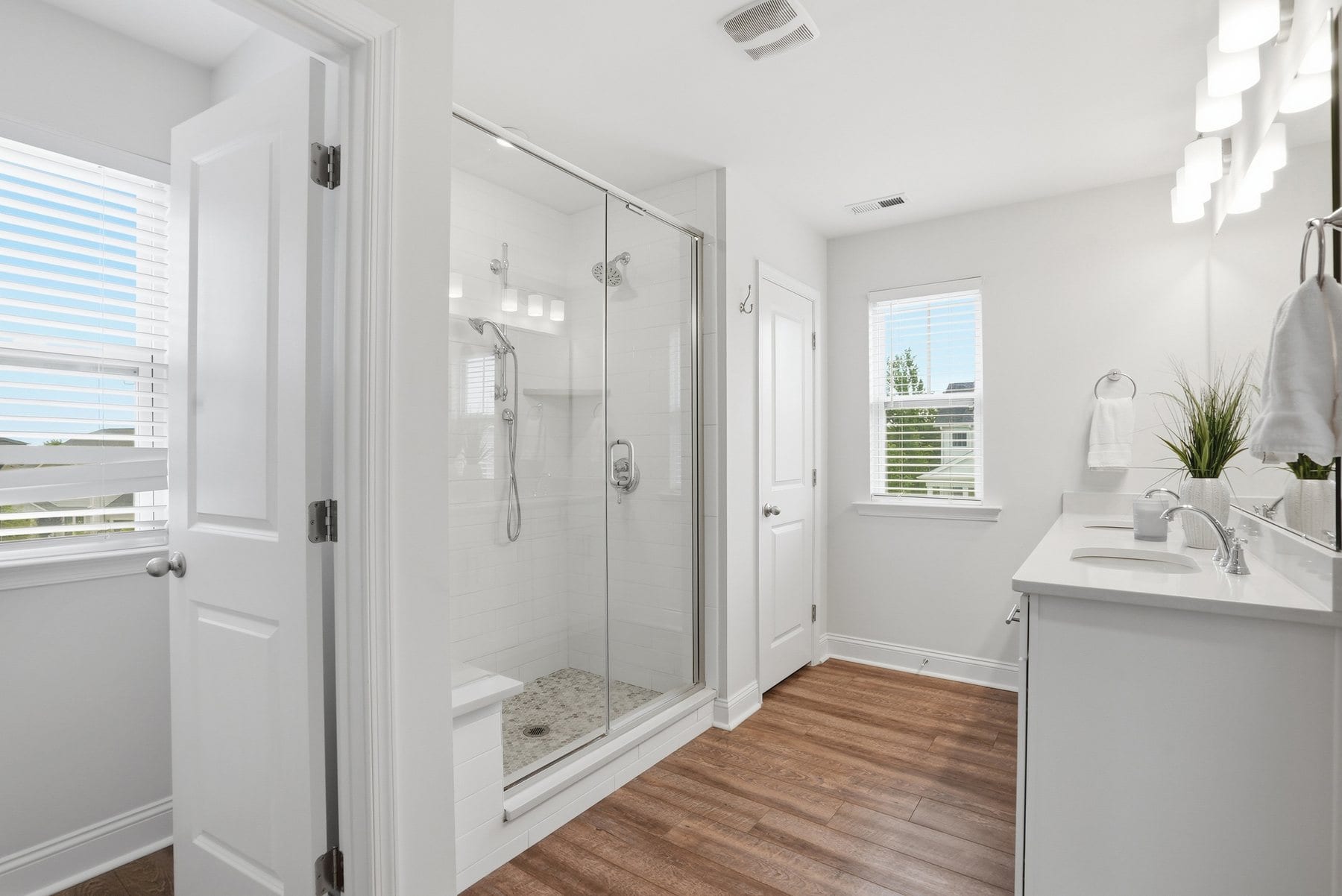 Tiled walk-in shower with a glass enclosure